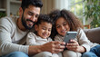 © Ali Hamza Tullah - Enjoying online communication, shopping, booking on Internet, making order. Family resting with cellphone on home couch, Happy Arabic parents and two little children using smartphone together, Happy