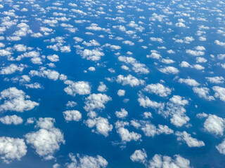 Blue sky and white clouds in the sky, top view from the clouds