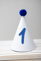 Wall Mural - white party hat with blue pompom and number one