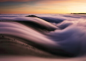 Wall Mural - autumn landscape, beautiful sunrise above the heavy clouds, mountain sea