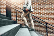 © TamJam/peopleimages.com - Businessman, legs and walking in city, stairs and commute in urban town to office building. Male person, shoes and professional on journey to workplace, outdoor and employee travel on steps to metro