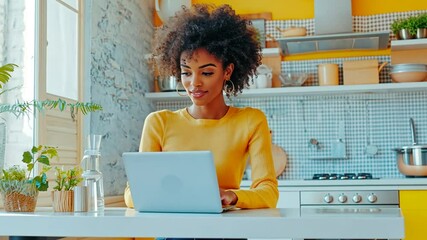 Poster - Young Black Woman Working on a Laptop in a Bright Kitchen in the Afternoon Generative AI