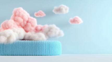 Poster - Soft pink and white clouds floating above a textured blue cushion on a minimalist background, creating a dreamy and serene atmosphere.