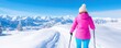 © MstSanta - woman skiing on snow covered mountain on sunny day, wearing jacket and cap