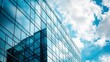 © Adi - A fragment of a modern office building in the capital .glass buildings with cloudy blue sky background .modern office building
