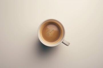 Poster - A cup of coffee sits on a white table in a simple yet inviting setting