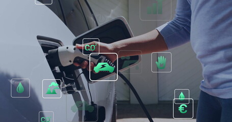 Poster - Image of eco icons and data processing over caucasian man charging electric car