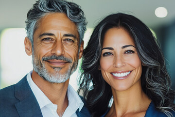 Smiling couple in a portrait.