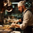 © BerkahStock - A chef prepares a dish in a bustling kitchen, showcasing culinary skills and creativity.