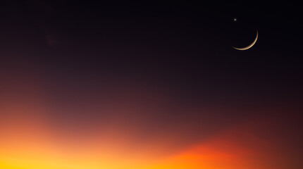 Wall Mural - dusk sky in the evening with orange sunlight after sun down twilight and crescent moon symbol religi