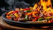 © Tanongsak idea photo - Close-up of sizzling fajitas with grilled vegetables on a hot skillet, emitting flames and steam, creating a mouth-watering visual experience.