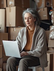 Wall Mural - Elderly Woman Engrossed in Laptop