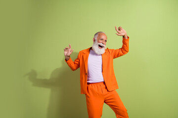 Poster - Photo of elegant handsome attractive retired man wear stylish suit crazy dance isolated on green color background