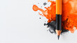 © Gibster - A vibrant splash of orange and black ink surrounds sharpened pencil, creating striking contrast against clean white background. This artistic composition evokes creativity and inspiration
