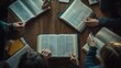 © Elmira - A group of friends actively discusses their thoughts and insights while surrounded by open Bibles and notebooks on a wooden table during a study session
