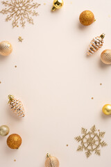 Wall Mural - a festive vertical arrangement of golden christmas ornaments and intricate snowflakes on a soft back