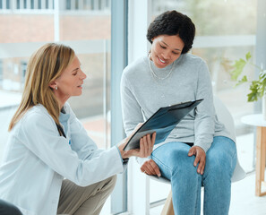 Wall Mural - Women, doctor and happy with patient on file with results, report and feedback on health progress at clinic. People, medical professional and smile with folder for good news and healing on diagnosis