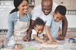 © Flashizzle/peopleimages.com - Cookies, baking and black family in kitchen for bonding, learning and skill development in home. Dough, ingredients and African parents teaching children to cook for growth and fun at house.