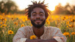 © Vertigo Images - Smiling man with afro in a field of yellow flowers
