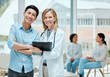 © peopleimages.com - People, doctor and portrait with patient on file with results, report and feedback on health progress at clinic. Happy, medical professional and smile on folder for good news or healing on diagnosis