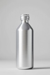 Canvas Print - A metal bottle with a metal cap sitting on a table, great for interior or product photography