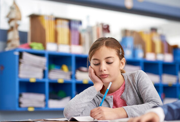 Poster - Bored, education and writing with girl student in classroom of school for child development or study. Learning, notebook and tired with unhappy learner kid at desk in class for future, growth or test