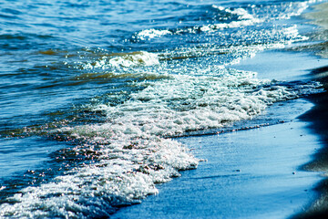 Wave of Water Breaks at the Sandy Lake Shoreline in White, Blues & Tans Background, Backdrop, Border, Frame, Wallpaper