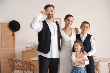 Canvas Print - Happy Jewish family with book at home