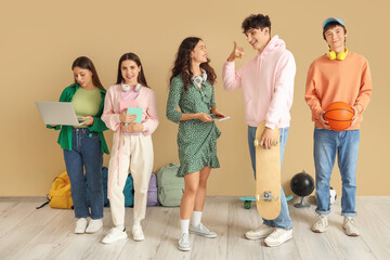 Canvas Print - Group of teenage students near beige wall