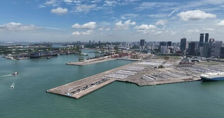 Wall Mural - Container industrial and commercial trade port and skyline in Singapore. Aerial drone video