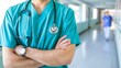 © Ilja - Confident Doctor In Green Scrubs Standing In Hospital Hallway, Medical Professional On Labor Day