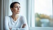 © Peter@studio5 - Breast cancer patient sitting by a window reflecting on her journey selective focus - Personal introspection and resilience - ethereal - Fusion - Window backdrop