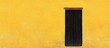 © GenZGraphics - Black door opening onto a yellow wall
