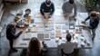 © Oscar - A team of designers collaborating on a mood board, with materials and color swatches spread out on a large table