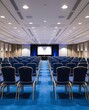 © you're doing great! - Empty conference hall with blue chairs Rear view (22)