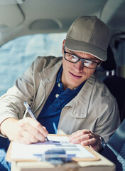 Aufkleber - Writing, courier service and delivery man in vehicle with clipboard, check and order for shipping. Male person, employee and happy as driver with boxes for transport, freight and ecommerce logistics