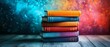 © Nattapat - Creative image of a stack of colorful books with dynamic backgrounds, showcasing diverse genres, modern and inviting design