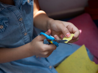 Children and adults make shapes and sculptures with play dough and draw pictures.