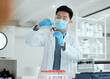 © peopleimages.com - Scientist, blood test or man in laboratory for science breakthrough, clinical trial or discovery. DNA vial, medical biology or mask for vaccine research with vial for mpox cure or disease development