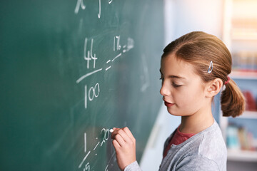 Poster - Little girl, writing and mathematics with chalkboard in classroom for education, learning or problem solving at school. Female person, child or young kid with math equation, numbers or sum for answer