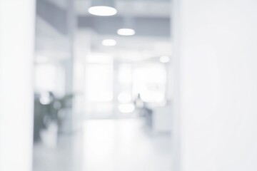 Wall Mural - Minimalist office interior with blurred light and shadow, white tones, and bokeh effect, capturing a modern, bright, and abstract space with no visible people or equipment in focus.