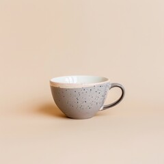 Wall Mural - A Small Gray and White Ceramic Mug with a Handle