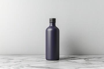 Canvas Print - A Single Matte Black Glass Bottle with a Silver Cap on a Marble Surface