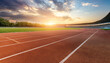 © UNeed - empty running track with sunset on background