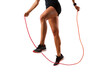 © SaroStock - A person performing jump rope exercises indoors with focus on footwork and coordination during a fitness routine