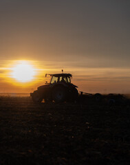 Wall Mural - Tractor preparing the land for a new crop planting