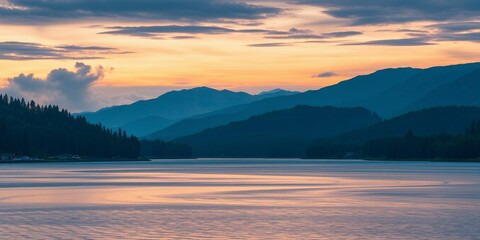 Sticker - Silhouetted mountains reflected in calm water at sunset.