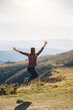 © Buyanskyy Production - Woman Jumping with Joy in Carpathian Mountains, Ukraine