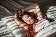 © Tatyana Gladskih - Young Smiling Woman Sleeping at bed