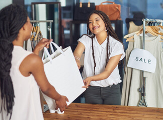 Canvas Print - Cashier, women or customer with shopping bag in fashion shop or retail checkout for store purchase. Giving, buy and counter in boutique with designer or smile for clothing product, discount or sale